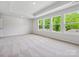 Large bedroom with trey ceilings and multiple large windows at 10121 Mamillion Dr, Huntersville, NC 28078