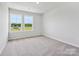 Well-lit bedroom with two large windows offering a pleasant view at 10121 Mamillion Dr, Huntersville, NC 28078