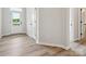 Bright entryway showcasing durable laminate flooring and neutral paint at 10121 Mamillion Dr, Huntersville, NC 28078