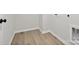 Bright laundry area with vinyl flooring and modern hook at 10121 Mamillion Dr, Huntersville, NC 28078