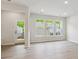 Bright living room featuring recessed lighting, light wood floors, and multiple windows for natural light at 10121 Mamillion Dr, Huntersville, NC 28078
