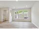 Sun-filled living room showcasing laminate flooring and neutral paint at 10121 Mamillion Dr, Huntersville, NC 28078