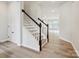 Elegant staircase featuring modern railing design and wood floors at 10121 Mamillion Dr, Huntersville, NC 28078