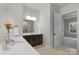 Bathroom with double sinks, white countertops, and a mirror at 1124 Greenbridge Dr, Matthews, NC 28105