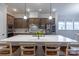 Bright kitchen with a large island, pendant lighting, stainless steel appliances and wood cabinets at 1124 Greenbridge Dr, Matthews, NC 28105
