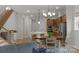 Open-concept living space with hardwood floors, a staircase, and a modern kitchen in view at 1124 Greenbridge Dr, Matthews, NC 28105