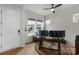 Bright home office with a large window, ceiling fan and ornate desk with multiple monitors at 1124 Greenbridge Dr, Matthews, NC 28105