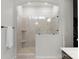Shower with tile walls, a glass door, and a small window at 1124 Greenbridge Dr, Matthews, NC 28105