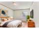 Bright bedroom with white walls, a mounted TV, and warm wood-colored furniture at 1149 Rollingbrook Ct, Kings Mountain, NC 28086