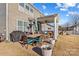 Spacious backyard patio with seating area, fire pit, and grill at 138 Byers Commons Dr, Mooresville, NC 28117