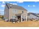 Large backyard with patio, fire pit, and seating area at 138 Byers Commons Dr, Mooresville, NC 28117