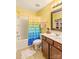 Bathroom with multicolored shower curtain and wood vanity at 138 Byers Commons Dr, Mooresville, NC 28117