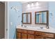 Shared bathroom with double vanity and light blue walls at 138 Byers Commons Dr, Mooresville, NC 28117