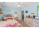 Bedroom with pink and gray decor, dresser, and TV at 138 Byers Commons Dr, Mooresville, NC 28117