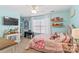 Bedroom with pink bedding, dresser, and wall shelves at 138 Byers Commons Dr, Mooresville, NC 28117
