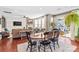 Bright dining area with a wooden table and chairs, adjacent to the living room at 138 Byers Commons Dr, Mooresville, NC 28117