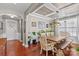 Bright dining room featuring a rustic wooden table and hardwood floors at 138 Byers Commons Dr, Mooresville, NC 28117