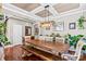 Farmhouse style dining room with a wooden table and bench at 138 Byers Commons Dr, Mooresville, NC 28117