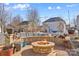 Stone fire pit in the backyard, perfect for gatherings at 138 Byers Commons Dr, Mooresville, NC 28117
