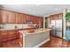 Island kitchen with granite countertops and stainless steel appliances at 138 Byers Commons Dr, Mooresville, NC 28117