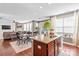 Open concept kitchen with island, granite countertops, and stainless steel appliances at 138 Byers Commons Dr, Mooresville, NC 28117
