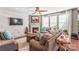 Cozy living room featuring a fireplace, hardwood floors and neutral decor at 138 Byers Commons Dr, Mooresville, NC 28117