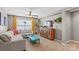 Spacious living room with sectional sofa and teal coffee table at 138 Byers Commons Dr, Mooresville, NC 28117