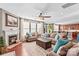 Spacious living room with a fireplace, hardwood floors, and ample natural light at 138 Byers Commons Dr, Mooresville, NC 28117
