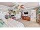 Main bedroom with TV, dresser, and access to bathroom at 138 Byers Commons Dr, Mooresville, NC 28117
