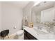 Bright bathroom featuring a modern vanity, toilet, and shower with tiled walls and stylish accents at 14041 Whistling Teal Dr, Charlotte, NC 28262