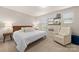 Cozy bedroom with a plush carpet, a wooden headboard, soft white linens, and a comfortable armchair at 14041 Whistling Teal Dr, Charlotte, NC 28262