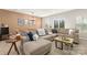 Comfortable living room features a large sectional sofa, neutral decor, and sliding glass doors to the outdoors at 14041 Whistling Teal Dr, Charlotte, NC 28262