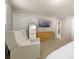 Bright main bedroom with a cozy chair, dresser, and an ensuite bathroom, offering comfort and convenience at 14041 Whistling Teal Dr, Charlotte, NC 28262