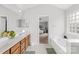 Elegant bathroom with double vanity and soaking tub at 1458 Bedlington Nw Dr, Charlotte, NC 28269