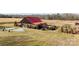 Aerial view of a rustic barn venue with surrounding fields and landscaping at 15554 Highway 601 S Hwy, Midland, NC 28107