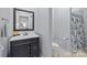 Clean bathroom with dark vanity and shower/tub combo at 15554 Highway 601 S Hwy, Midland, NC 28107