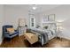 Bright bedroom with a queen-size bed and hardwood floors at 15554 Highway 601 S Hwy, Midland, NC 28107