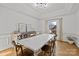 Bright dining room with hardwood floors, large window, and farmhouse table at 15554 Highway 601 S Hwy, Midland, NC 28107