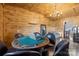 Rustic game room with a poker table, leather chairs, and a comfy couch at 15554 Highway 601 S Hwy, Midland, NC 28107