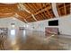 Event space with exposed beams, string lights, and a large TV screen at 15554 Highway 601 S Hwy, Midland, NC 28107