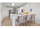 Kitchen boasts white cabinets, quartz counters & breakfast bar at 15554 Highway 601 S Hwy, Midland, NC 28107
