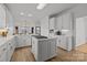 Bright kitchen with white cabinets, island, and gas cooktop at 15554 Highway 601 S Hwy, Midland, NC 28107