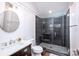 Contemporary bathroom with a walk-in shower and dark tile at 2002 Summey Ave # 4, Charlotte, NC 28205