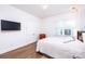 Bright bedroom with hardwood floors, a large window, and TV at 2002 Summey Ave # 4, Charlotte, NC 28205
