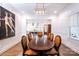 Elegant dining room with large oval table and statement artwork at 2002 Summey Ave # 4, Charlotte, NC 28205