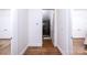 Clean hallway with hardwood floors and access to bedrooms and bathrooms at 2002 Summey Ave # 4, Charlotte, NC 28205