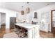 Modern kitchen features a large island, stainless steel appliances, and white shaker cabinets at 2002 Summey Ave # 4, Charlotte, NC 28205