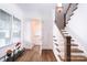 Modern staircase with hardwood floors and white railings at 2002 Summey Ave # 4, Charlotte, NC 28205