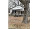 White house with porch, needs some work at 206 Barnyard Ln, Statesville, NC 28625