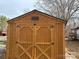 Wooden storage shed with double doors at 206 Barnyard Ln, Statesville, NC 28625